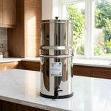 British Berkefeld Stainless steel water filter on a kitchen counter with a window in the background